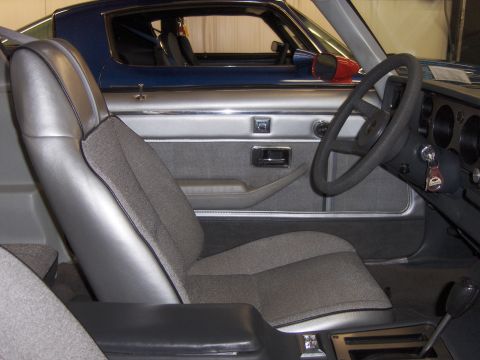 1979 Chevrolet Camaro - The interior of a car is shown, with a second vehicle visible through the window.