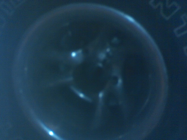 Close-up of tire tread with Supermotors.net logo