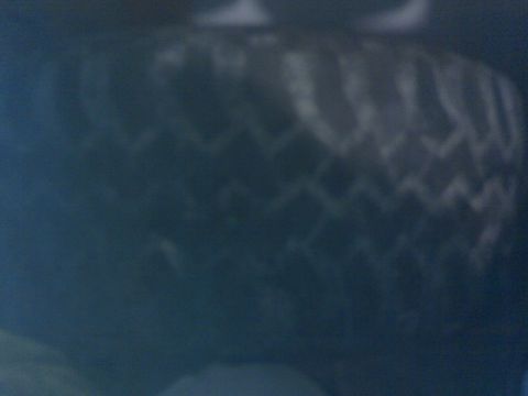 1996 Ford Bronco - The tread pattern on this tire is clearly visible.