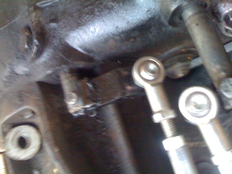 close-up of transfer case linkage with rod ends