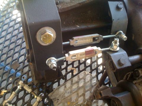 1978 Ford Bronco - Transfer case linkage components, including turnbuckles and mounting hardware.
