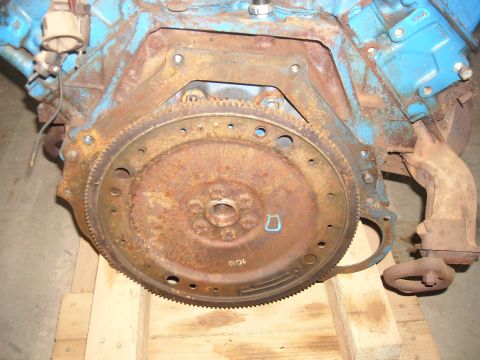 1978 Ford F-250 - This engine part shows significant rust and wear, with some blue paint visible on the block.