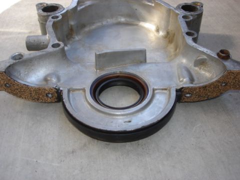 1992 Ford Bronco - This is a close-up of an engine part, possibly a crankshaft seal housing, with a new seal and gasket installed.