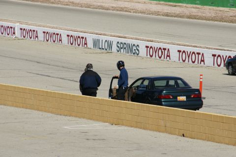 1995 Ford Taurus - 1995 Ford Taurus on the Willow Springs track, driver's door open.