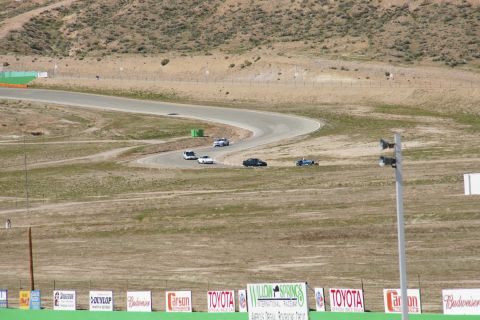 1995 Ford Taurus - Cars on a race track at Willow Springs International Raceway.