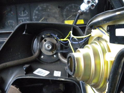 1989 Ford Bronco - Steering column components and wiring are visible, with dashboard gauges in the background.
