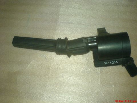 1998 Ford Crown Victoria - A single black ignition coil is shown against a textured background.