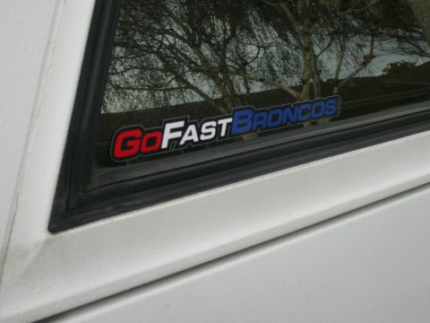 1988 Ford Bronco - Sticker on window reads "Go Fast Broncos". Year is not visible.