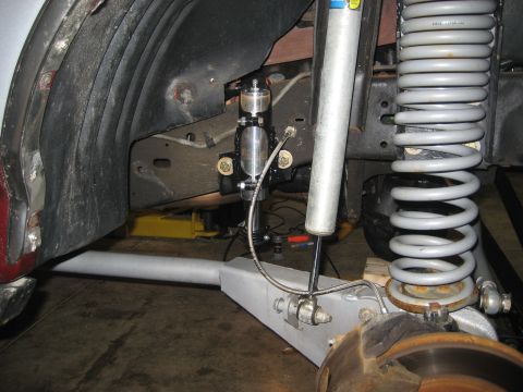 1996 Ford Bronco - Close-up view of the air bump stop and suspension system, likely an aftermarket modification.
