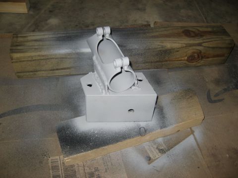 1996 Ford Bronco - A painted metal bracket is shown resting on wooden blocks and cardboard.