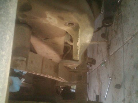 1982 Ford Bronco - Close-up of vehicle undercarriage parts, showing suspension and frame elements.