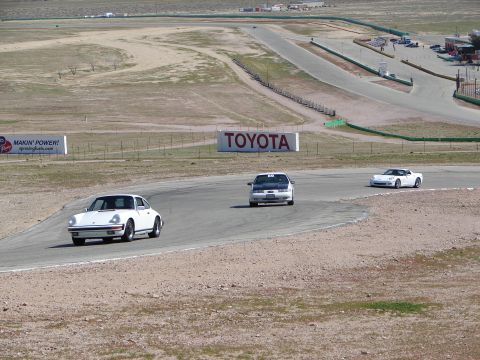 1992 Ford Taurus - Multiple vehicles compete on a race track, with a prominent Toyota sign visible.