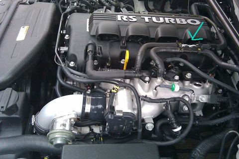2010 Hyundai Genesis - Close-up view of an engine's intake manifold, "RS TURBO" branding.