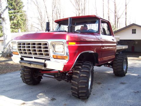 1978 Ford F-150 - This modified pickup truck features oversized tires and prominent exhaust stacks, suggesting it's built for off-road use.