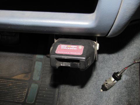 1993 Ford F-250 - A Tekonsha trailer brake controller is visible mounted beneath the dashboard of a vehicle.