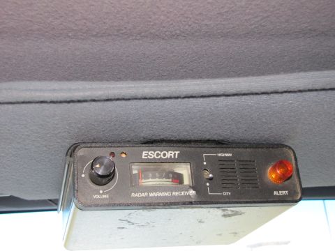 1993 Ford F-250 - Close-up of an Escort radar warning receiver unit mounted inside a vehicle.