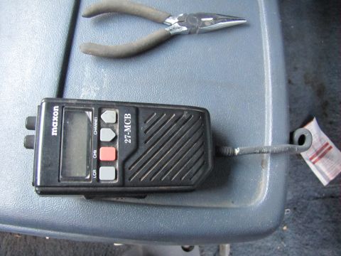1993 Ford F-250 - A Maxon 27-MCB CB radio and a pair of pliers are placed on a textured gray surface.