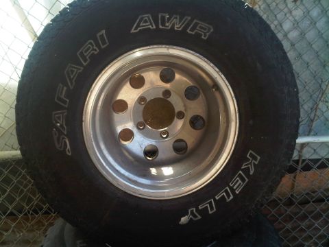 1985 Ford Bronco - A single tire and wheel assembly is shown, with text visible on the tire's sidewall.