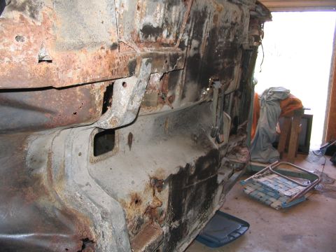 1970 Ford Mustang - This heavily corroded vehicle frame shows extensive rust damage and missing components, indicating a state of disrepair.