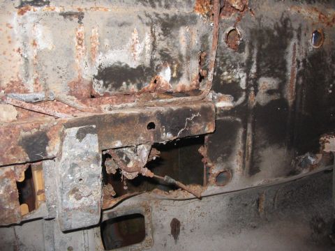 1970 Ford Mustang - The structural integrity of this vehicle's frame is compromised by extensive rust and decay.
