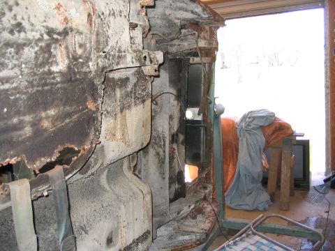1970 Ford Mustang - This heavily rusted vehicle frame shows significant structural decay, indicating extensive damage or neglect.