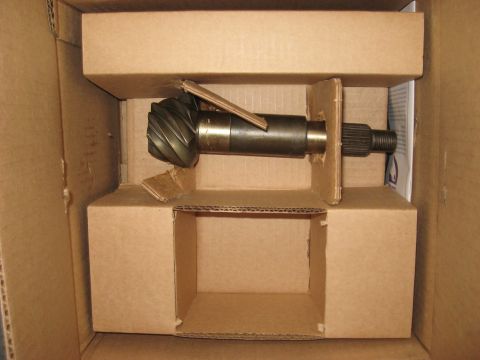 2008 Ford F-250 - A differential gear and pinion shaft are shown packaged in cardboard for shipping.