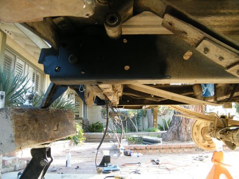 1982 Ford Bronco - Underside view of a vehicle's frame and suspension system, showing various mechanical components and wiring.