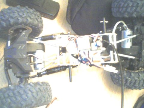 1989 Ford Bronco - Chassis of a remote control car, showing its internal mechanical and electrical systems.