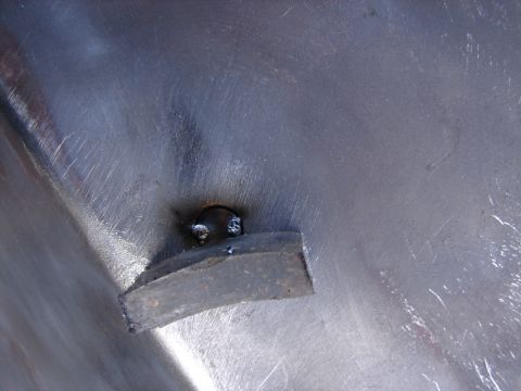 1973 Ford Ranchero - A close-up view of a metal part showing a weld and an attached rectangular piece.