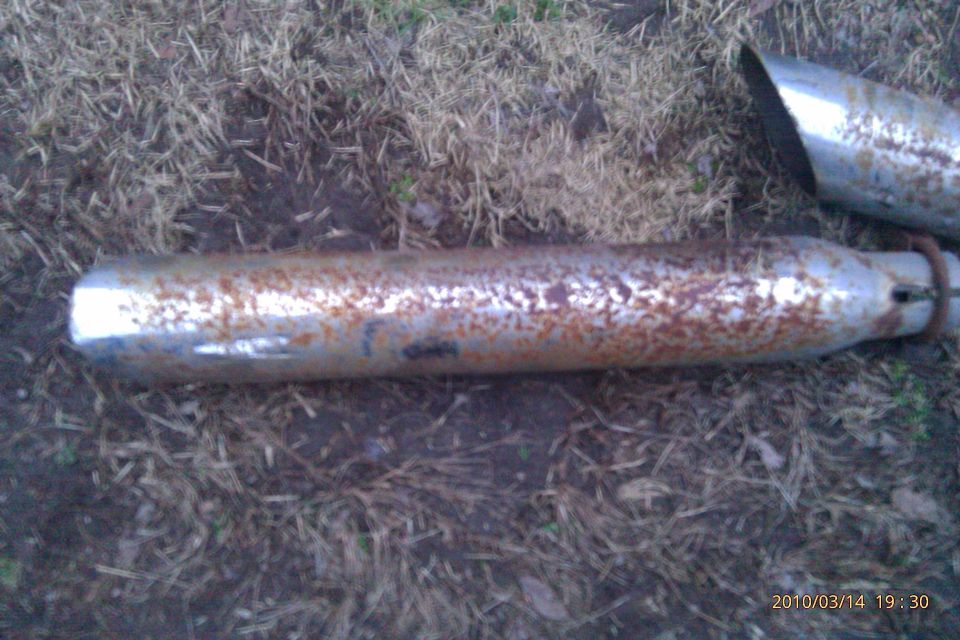 rusty exhaust pipe and tip on the ground