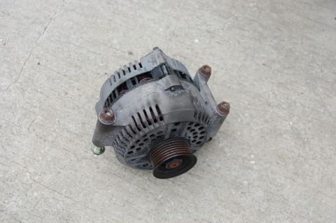 1994 Ford Bronco - This is an automotive alternator, a key component for a vehicle's electrical system.
