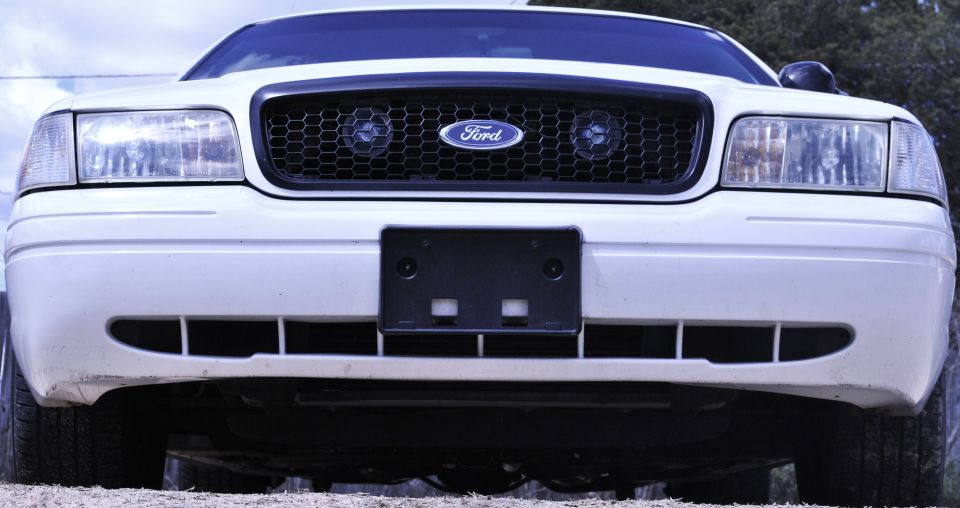White 2002 Ford Crown Victoria front grille with honeycomb pattern