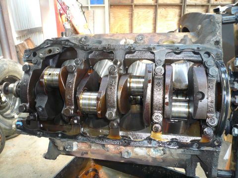 1975 Ford Ranchero - Internal view of an engine block showing the crankshaft and connecting rods.