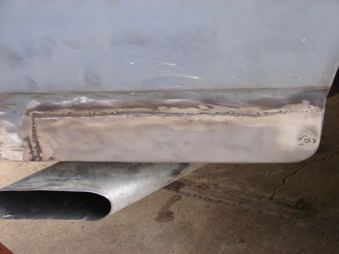 1973 Ford Ranchero - Body panel repair work in progress, showing a welded patch and primer.