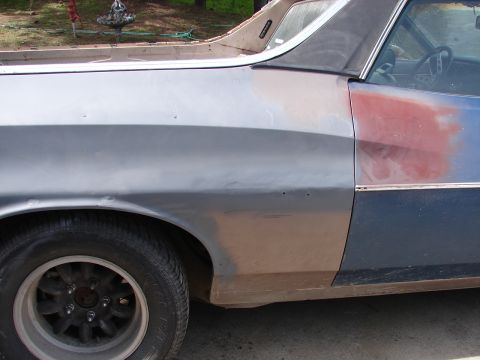 1973 Ford Ranchero - This vehicle is undergoing body repairs, with primer visible on the fender and door.