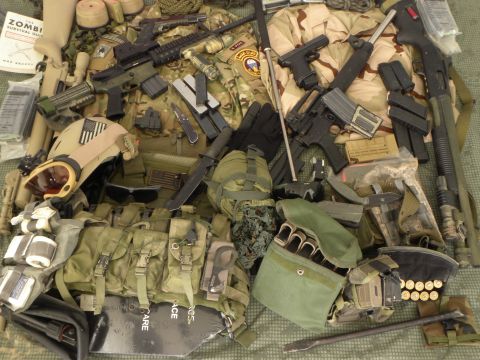 1995 Ford Bronco - A collection of firearms and tactical equipment is laid out, suggesting preparedness for various scenarios.