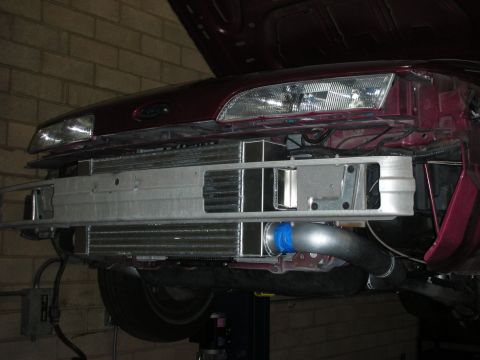 1992 Ford Crown Victoria - Custom intercooler setup visible behind the front bumper of a vehicle.