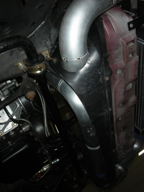 1992 Ford Crown Victoria - Custom intercooler piping is installed near the radiator in this engine bay view.