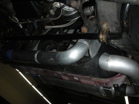 1992 Ford Crown Victoria - Custom intercooler piping is visible underneath the vehicle, silver aluminum tubes and black hoses.