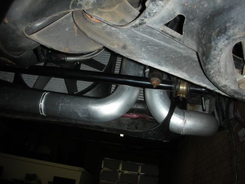 1992 Ford Crown Victoria - Custom exhaust piping and radiator fan visible from underneath a vehicle.