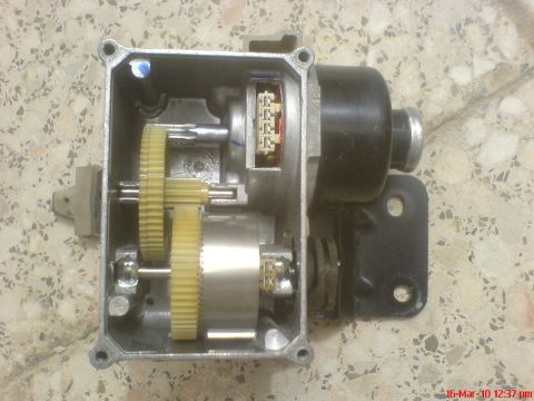 1998 Ford Crown Victoria - Internal view of a cruise control actuator, showing the gear train and motor assembly.