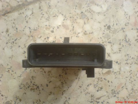 1998 Ford Crown Victoria - A close-up view of a vehicle's electrical connector, likely for a cruise control module.