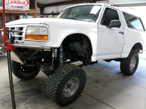 1996 Ford Bronco - 1996 Ford Bronco modified for off-road use, shown with a jack.