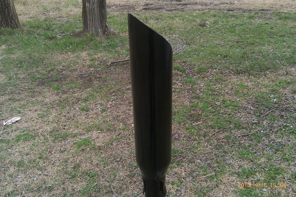 black exhaust pipe sticking out of the ground