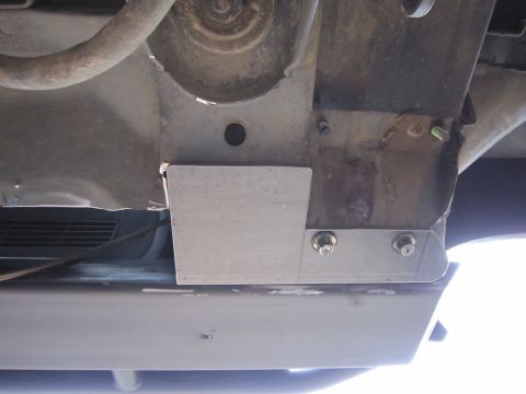 1996 Ford Bronco - Underside view of a vehicle's frame, showing added metal plating for protection.