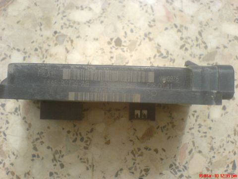 1998 Ford Crown Victoria - Close-up of an electronic control module, showing part numbers and date codes.