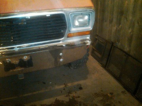 1987 Ford Bronco - Close-up of a vintage Ford truck's front end, showing the grille and bumper details.