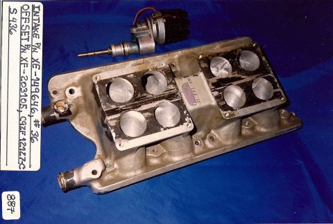 1973 Ford Mustang - An intake manifold and distributor assembly are shown, with part numbers visible on the manifold.