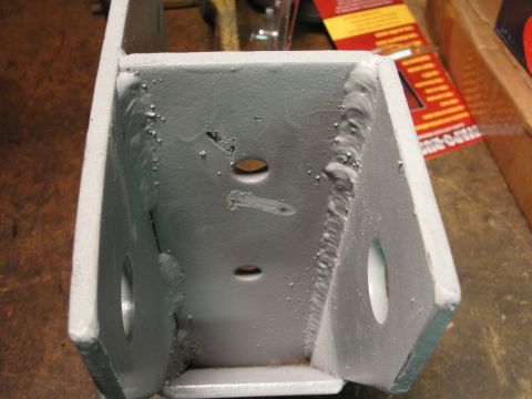 1995 Ford Bronco - This is a close-up view of a welded metal bracket, likely a vehicle part.