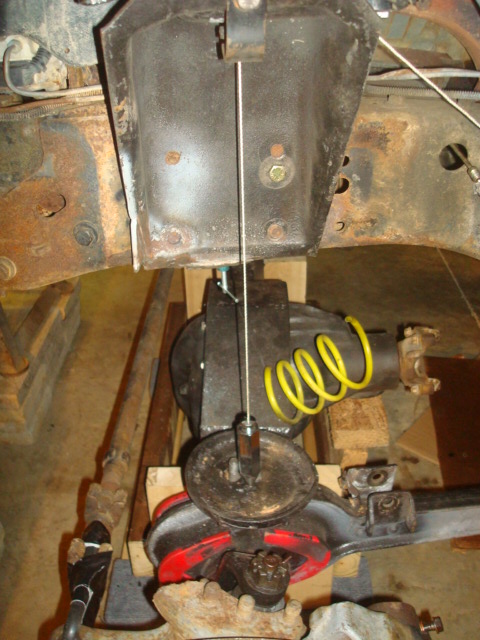 1995 Ford Bronco - Undercarriage view of vehicle suspension components, showing a differential and spring.